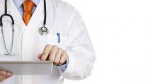 Doctor works on a tablet